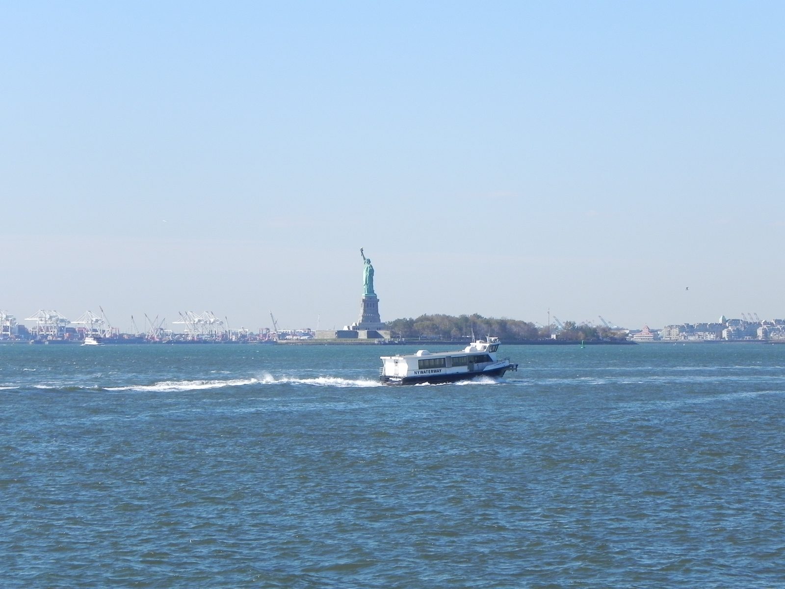 The Statue of Liberty seen from the deck of the Staten Island Ferry in New York Harbor