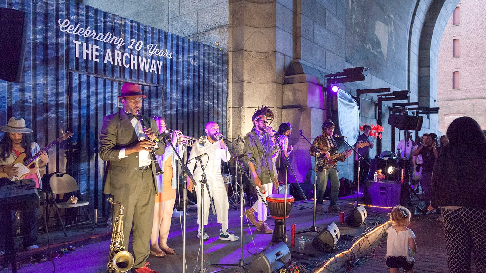 Live music on the stage under the Manhattan Bridge at the DUMBO Archway in Brooklyn